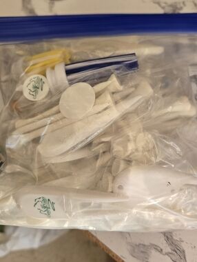 Quart Bag Full Of Divot Markers And Ts